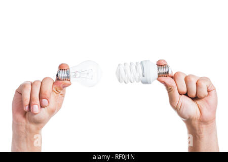 cropped view of choice between led and fluorescent lamps in male hands isolated on white, energy efficiency concept Stock Photo