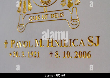 Trnava, Slovakia. 2018/4/12. The tombstone of the saintly bishop Pavol Hnilica with his motto: 'Quis ut Deus?' meaning: ''Who [is] like God?'. Stock Photo