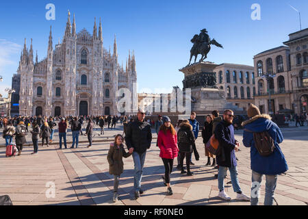 Milan, Italy - January 19, 2018: Tourists and ordinary people walk on Piazza del Duomo or Cathedral Square, the main city square of Milan Stock Photo