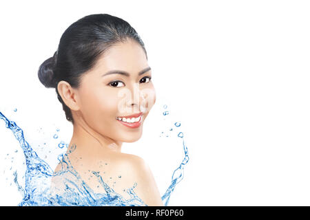 Pretty asian woman with splash of water and fresh skin isolated over white background. Skin care concept Stock Photo