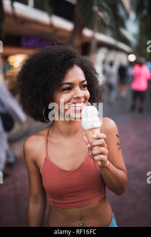 USA, Nevada, Las Vegas, happy young woman eating ice cream in the city Stock Photo