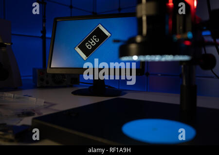 Laboratory of semiconductor chips. The development of modern electronics. crystal chip in the microscope Stock Photo