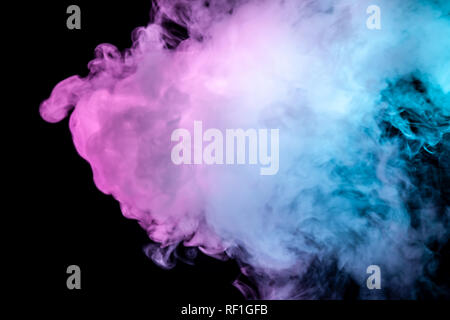 Multicolor, thick smoke, illuminated by colored in blue, purple and pink light against a dark black isolated background, welded with clubs and curls,  Stock Photo