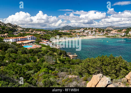 Picturesque Coastal View Looking Down on Cala Batistoni Beach and Village of Baia Sardinia in Summer. - Baia Sardinia, Gallura, Sardinia, Italy. Stock Photo