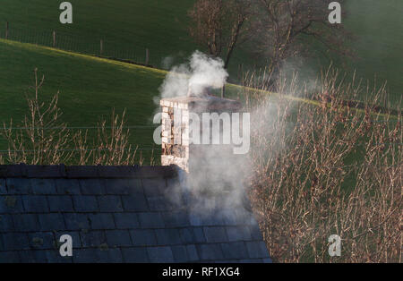 Smoke from a domestic chimney Stock Photo