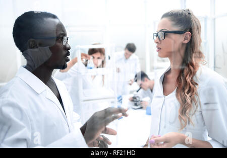 multinational scientists work in a modern laboratory Stock Photo