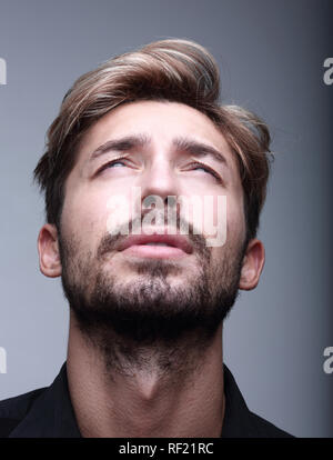 Portrait of a man with closed eyes, his head thrown back Stock Photo