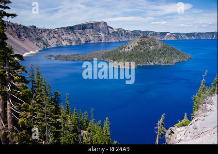 Crater Lake in Oregon is the deepest lake in the US, and because of its high altitude and snow in the mountains, the park is only open for a few month Stock Photo