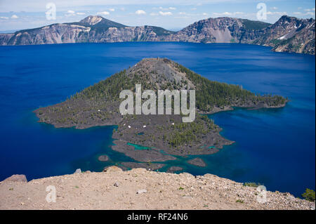 Crater Lake in Oregon is the deepest lake in the US, and because of its high altitude and snow in the mountains, the park is only open for a few month Stock Photo