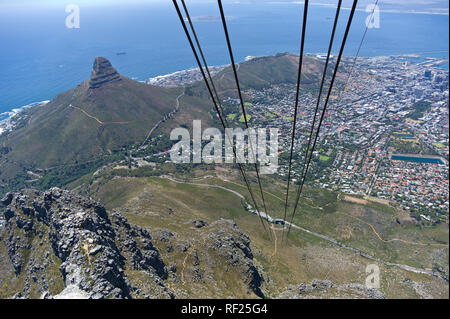 The Table Mountain cable car is one way to get to the top of the mountain that affords stunning views of the city and the hiking routes below. Stock Photo