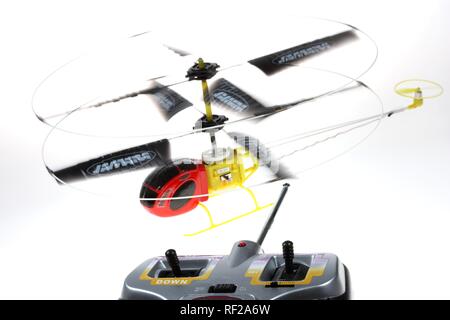 Remote controlled toy helicopter, minature model flown indoors Stock Photo