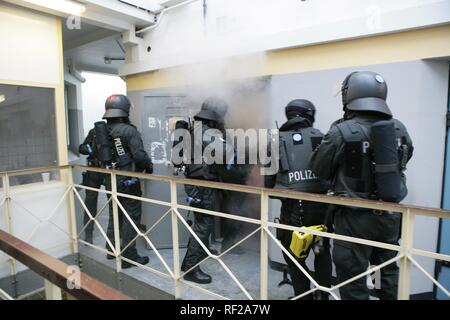 SWAT police officers armed and with gas masks. Real police special ...