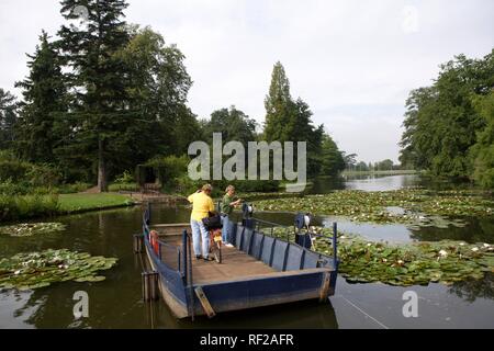 Small, manually-operated pedestrian ferry on its way to Roseninsel, Rose Island, Gartenreich Dessau-Woerlitz Stock Photo