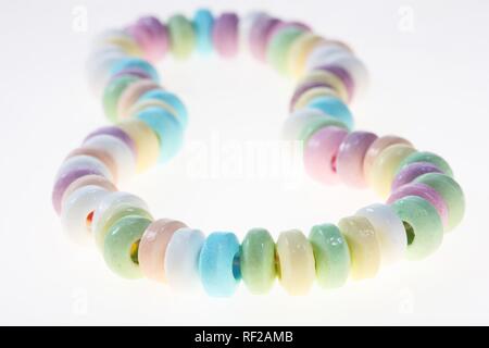 Necklace of coloured candy sweets Stock Photo