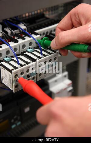 Measuring the voltage of electric circuits Stock Photo