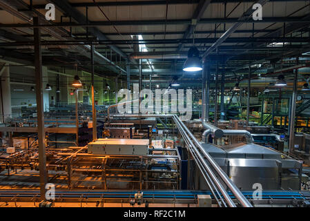 Industrial interior of soft drinks factory with tubes Stock Photo