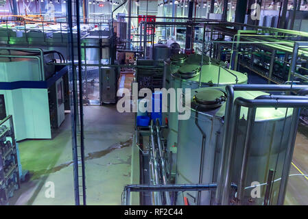 Metal reservoirs at a soft drink factory Stock Photo