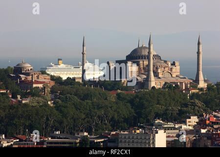 View over the Eminoenue district and the Golden Horn towards Hagia Sophia and a cruise liner, Istanbul, Turkey Stock Photo