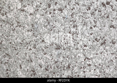 Artificial vinyl texture with imitation marble. Background with grey, white and brown crumbs. Copy space Stock Photo