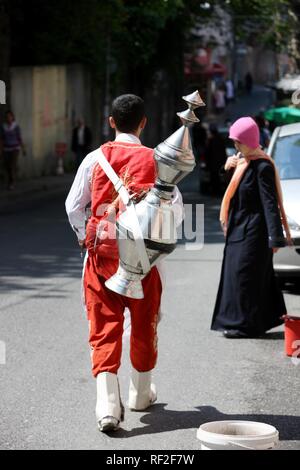 Man wearing traditional costume, selling tea on the roads of Sultanahmet, Istanbul, Turkey Stock Photo