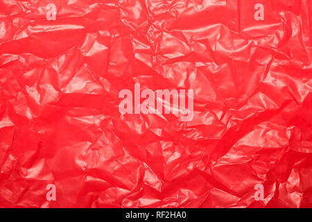 Wrinkled red plastic sheet for background or text. Stock Photo