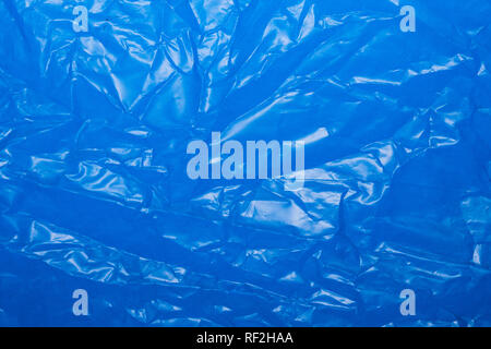 Wrinkled blue plastic sheet for background or text. Stock Photo