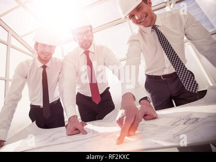 group of architects discussing sketches Stock Photo
