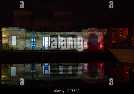 Leith, Edinburgh, Scotland, United Kingdom, 23 January 2019. Message from the Skies is a nightly light projection in six locations in the capital. It is commissioned by Edinburgh’s Hogmanay and Edinburgh International Book Festival, produced by Underbelly with Edinburgh UNESCO City of Literature Trust and supported by Creative Scotland. Leith Custom House with Chitra Ramaswamy's story A Love Letter to Europe Stock Photo