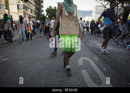 Caracas, Venezuela. 23rd Jan, 2019. People are protesting against Venezuelan President Maduro. Venezuelan parliamentary president Guaidó has declared the socialist government of Maduro to be deprived of power and has proclaimed himself head of state in transition. Minutes later, US President Donald Trump recognized the opposition leader as the legitimate interim president of the corruption- and poverty-stricken country. As a result, Maduro ordered the termination of diplomatic relations with the USA on Wednesday. The powerful military stood behind Maduro in the bitter power struggle. Photo: B Stock Photo