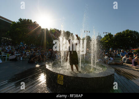 Melbourne, Australia. 24th Jan, 2019. Tennis: Grand Slam, Australia Open. A woman in full dress in a fountain in Melbourne Park. On Thursday, temperatures in the Australian metropolis reached 41 degrees Celsius. Credit: Frank Molter/dpa/Alamy Live News Stock Photo