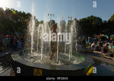 Melbourne, Australia. 24th Jan, 2019. Tennis: Grand Slam, Australia Open. A woman in full dress in a fountain in Melbourne Park. On Thursday, temperatures in the Australian metropolis reached 41 degrees Celsius. Credit: Frank Molter/dpa/Alamy Live News Stock Photo