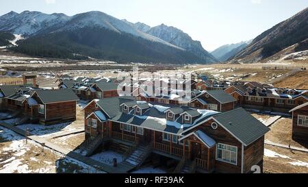 Shandan, China's Gansu Province. 23rd Jan, 2019. A tourist resort is seen at the Shandan Ranch with the Qilian Mountains in the background in Shandan County of Zhangye City, northwest China's Gansu Province, Jan. 23, 2019. Credit: Li Xiao/Xinhua/Alamy Live News Stock Photo