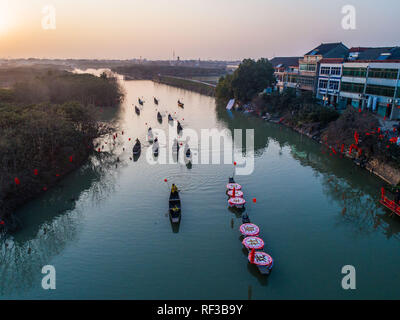 (190124) -- HANGZHOU, Jan. 24, 2019 (Xinhua) -- Aerial photo taken on Jan. 23, 2019 shows villagers rowing to watch traditional opera in Hexidai Village of Tangqi Township in Hangzhou, capital of east China's Zhejiang Province. Traditional Chinese classical operas like 'Liang Shanbo and Zhu Yingtai', also known as 'The Butterfly Lovers' are staged in Hexidai Village ahead of the Lunar New Year, or Spring Festival, which falls on Feb. 5 this year. (Xinhua/Xu Yu) Stock Photo