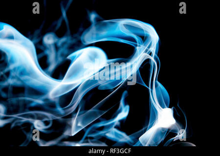 blue smoke swirl on black background Stock Photo