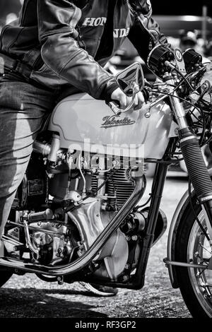 Vintage 1966 Velocette Thruxton motorcycle and rider. Classic british bike. Black and white Stock Photo