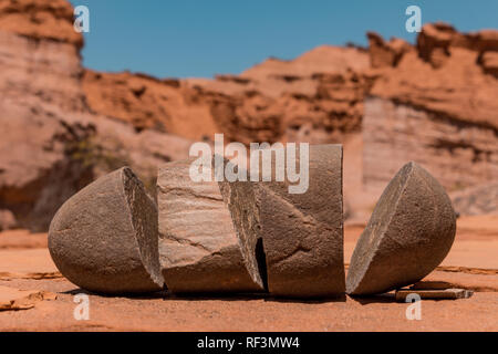Boulder stone split in some parts by the temperature. Mountainous desert landscape.