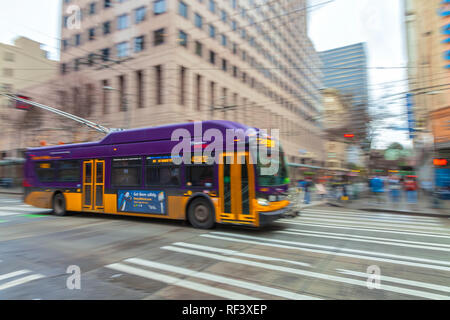 Camera panning of a moving trolley bus in downtown Seattle, Washington, United States Stock Photo