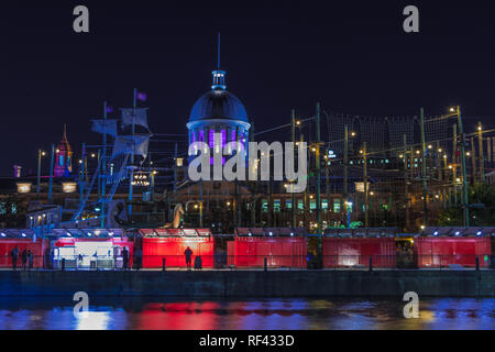 Montreal, Quebec, Canada, 2018 - View of the Old montreal at night - cityscape with the Bonsecours market illuminated in Purple. Reg containers stores Stock Photo