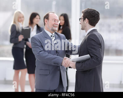 project Manager shaking hands with the employee prior to the seminar Stock Photo