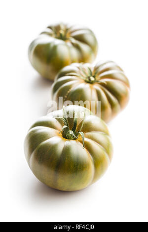 Dark brandywine tomatoes isolated on white background. Stock Photo