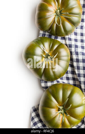 Dark brandywine tomatoes isolated on white background. Stock Photo