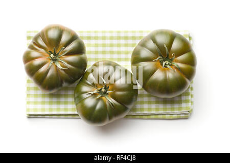 Dark brandywine tomatoes isolated on white background. Stock Photo