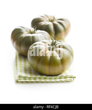 Dark brandywine tomatoes isolated on white background. Stock Photo