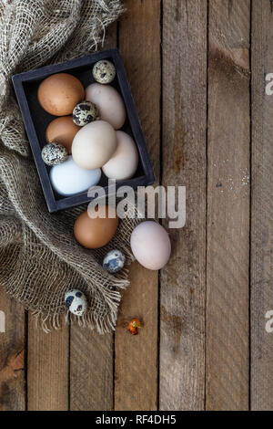 Farm eggs on wooden table background, copy space Stock Photo