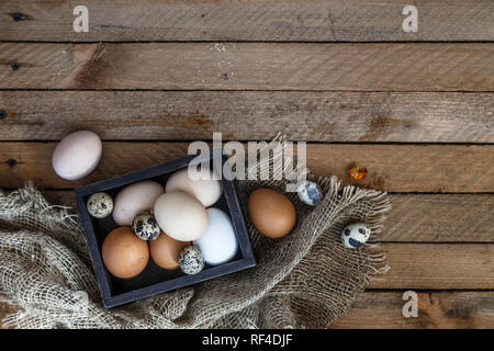 Farm eggs on wooden table background, copy space Stock Photo