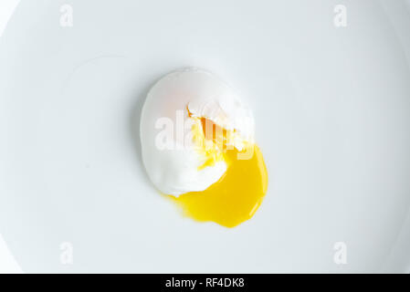 poached egg closeup shot on white background Stock Photo