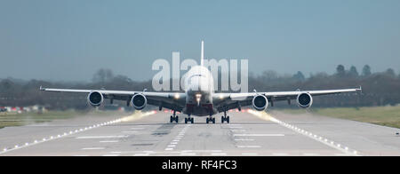 London Gatwick Airport, England, UK – December 09 2018: Front on view straight down the runway of an Emirates Airline A380 Airbus just as it takes off Stock Photo