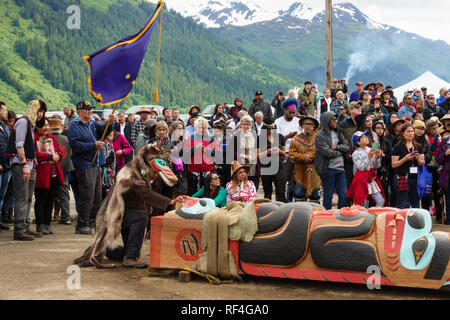 A crowd of people from the Tlingit, Tsimshian and Haida tribes gathered for a Native American Indian totem pole raising celebration, Juneau, Alaska Stock Photo