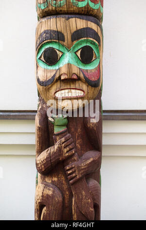 Detail of a traditional Northwest Coast Native American Tlingit Indian totem pole outside the Alaska State governor's mansion in Juneau, Alaska Stock Photo