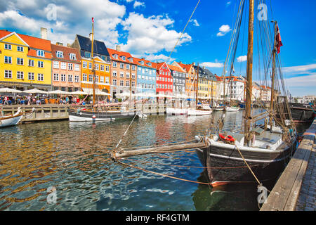 Copenhagen, Denmark-2 August, 2018: Famous Nyhavn (New Harbour) bay in Copenhagen, a historic 17 century European waterfront with colorful buildings.  Stock Photo